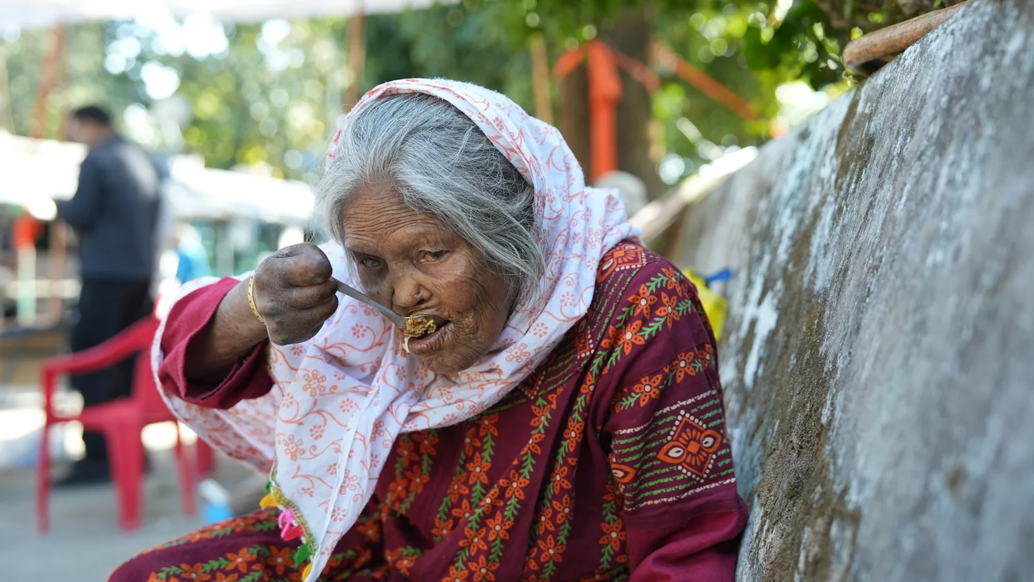 A closer view of a resident eating during the gathering.