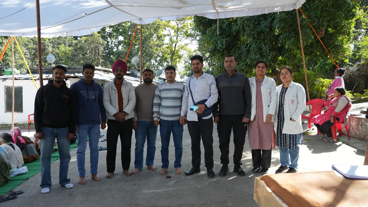 The outreach team gathers beside the community consultation space.