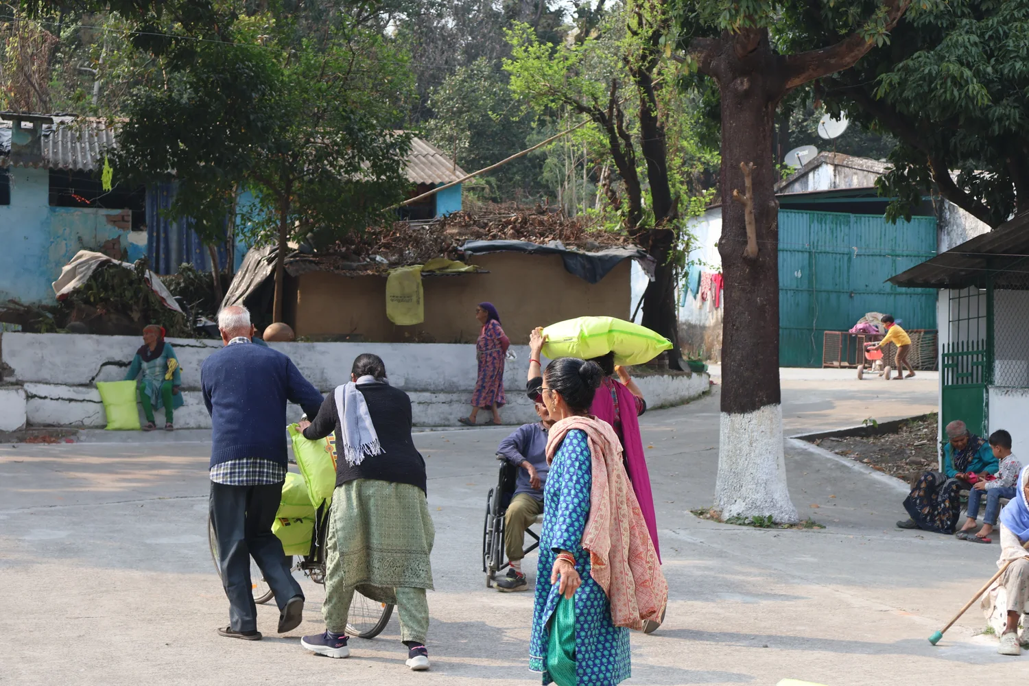 People move through the neighbourhood during ration collection.