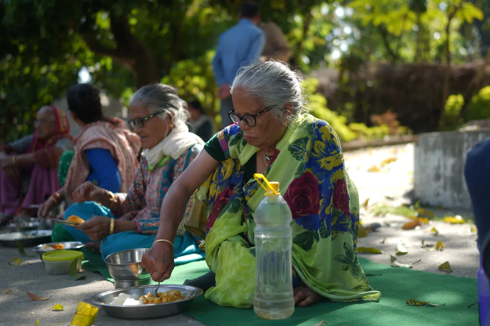 Older women sharing a meal together outdoors