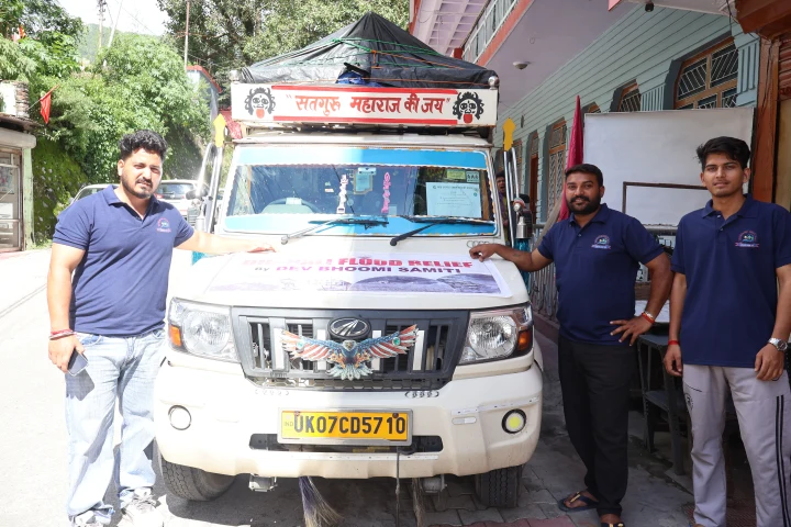 Team members preparing a vehicle for a community relief journey