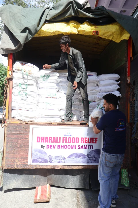 Dev Bhoomi Samiti relief vehicle stacked with essential supplies