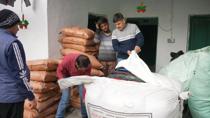 Food supplies being prepared for community distribution by Dev Bhoomi Samiti