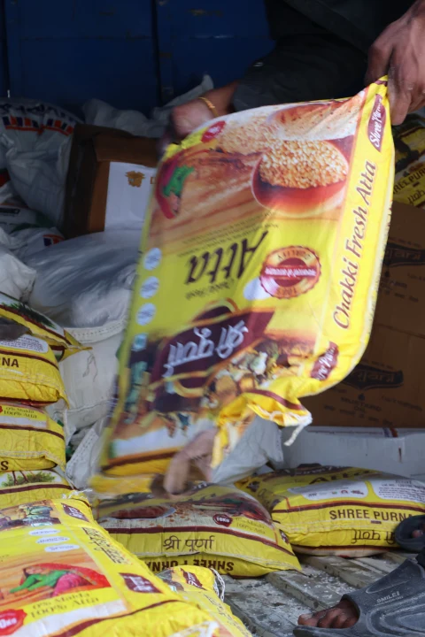 Packets of essential food supplies prepared for community distribution